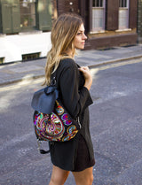 Snake Swirl BOH embroidered leather backpack handbag on model
